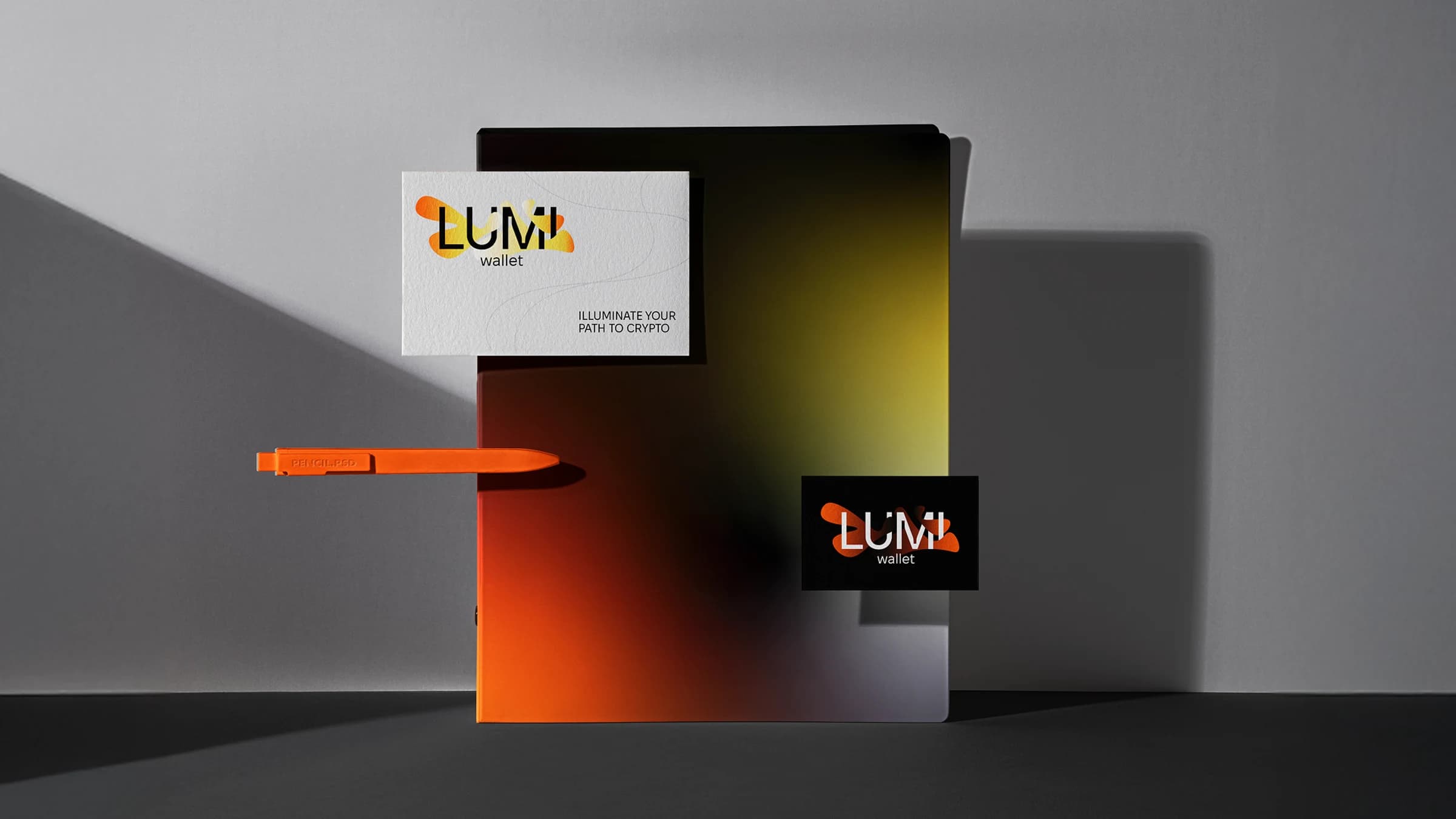 Lumi Wallet stationery with orange and yellow brand details