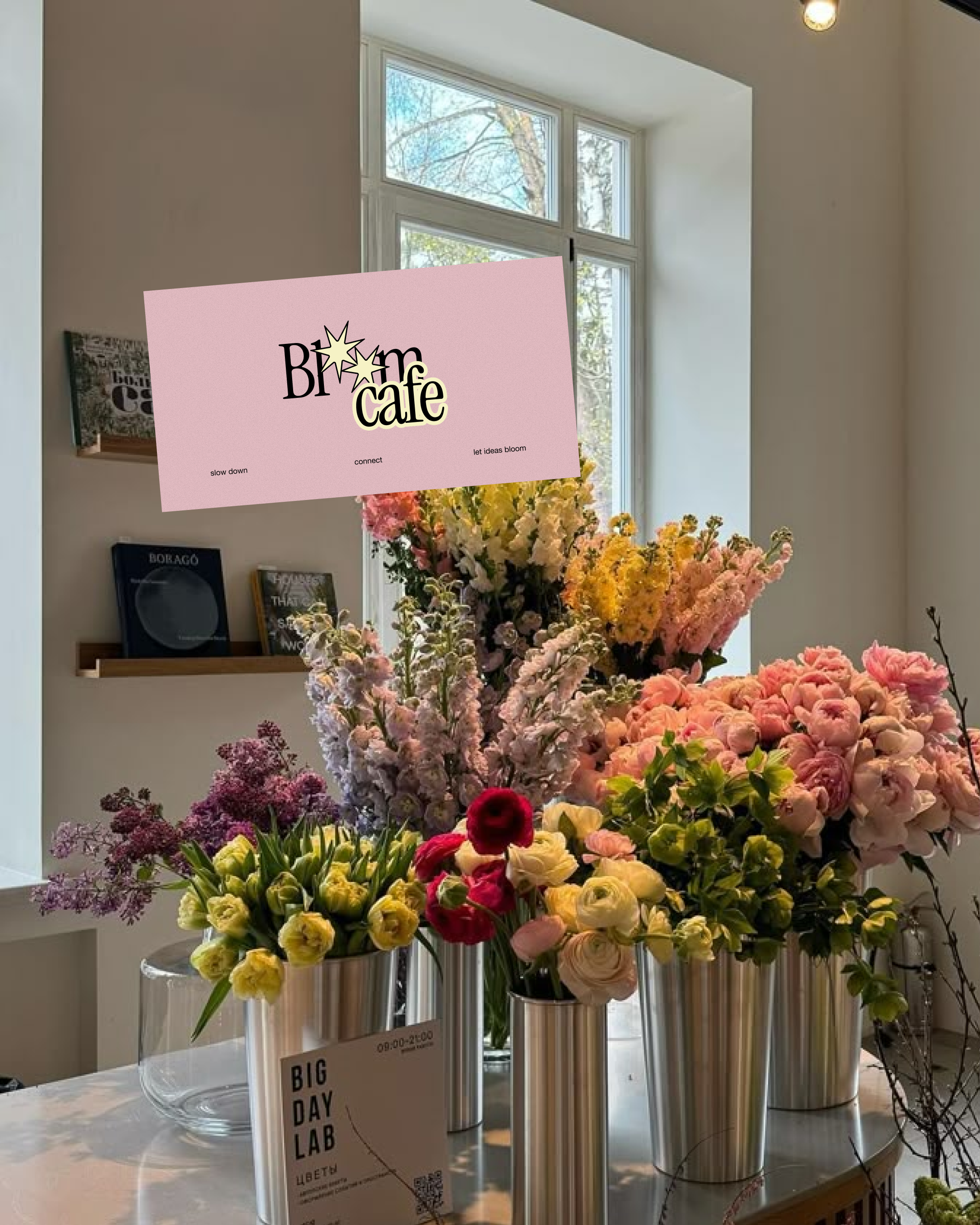 Bloom Cafe pink identity card above a florist display